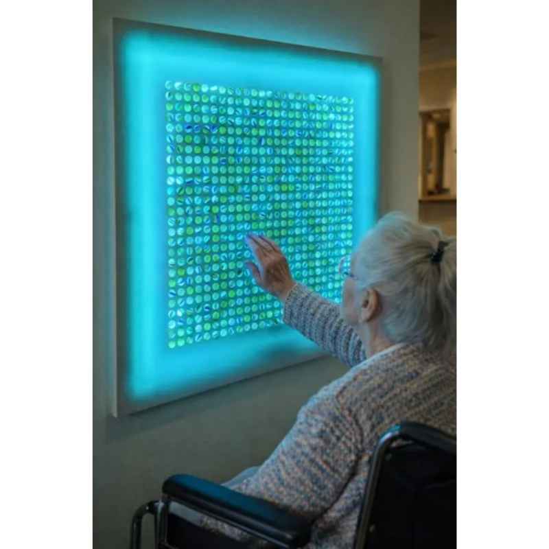 AHS_Marvelous_Sensory_Marble_Wall_Panel_2 - Person touching blue marble wall