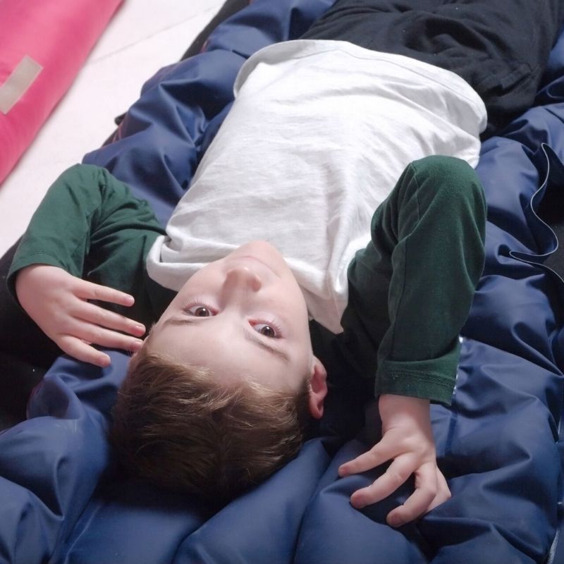 TFH Sensory Pressure Vinyl Ball Pad - Close up view child active play lying down 