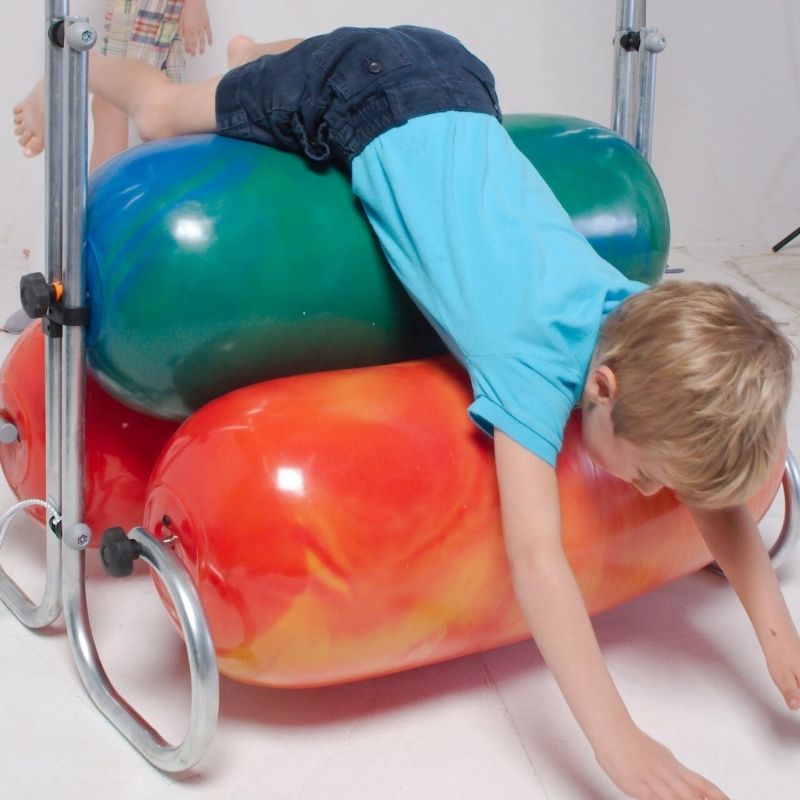 TFH Squeeze Machine - Toddler playing on top