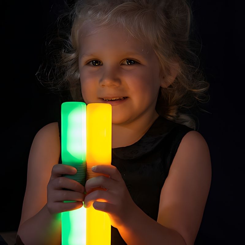 TTS Light Up Glow Cylinders - Child Close UP View Holding Cylinders
