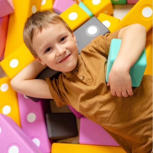 TUKI Big Magnetic Blocks Set - Builder 26 boy laying on blocks