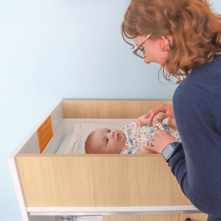 Whitney Brothers elevated™ Infant Changing Cabinet - Close Up Mother and Baby