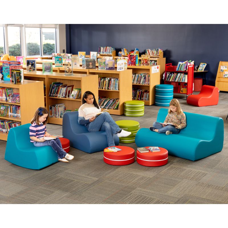 A school library reading corner featuring Jaxx flexible seating alongside active seating options like the Midtown Rocker