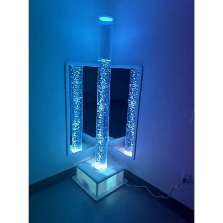 AHS Sensory Bubble Tube in blue LED lighting, showing colour-changing visual stimulation for sensory regulation in therapy and educational settings
