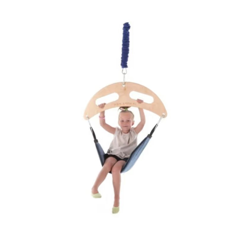 Child seated upright in the TFH Bungee Frog Swing holding the birch top, a vestibular therapy swing for bouncing sensory input