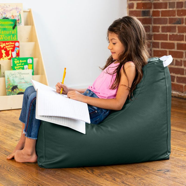 Child doing schoolwork on the Jaxx Pezzi classroom bean bag chair in sequoia green vinyl with a carry handle