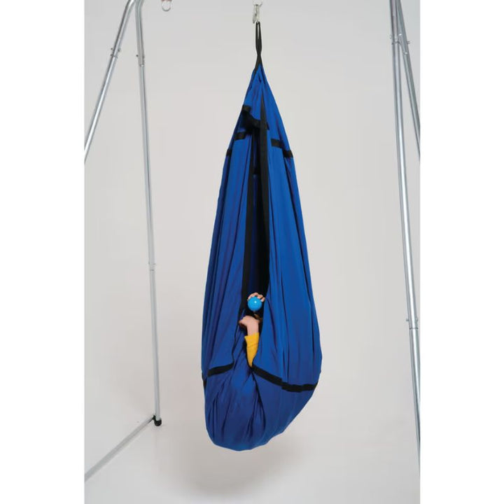 TFH Cocoon Swing hanging from a swing frame indoors, a pod-style sensory swing for vestibular and deep pressure input