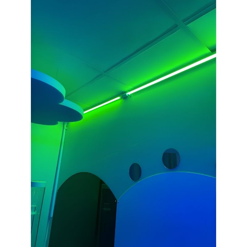 TFH Genie Colour Wash Kit strip lighting a sensory room wall and ceiling corner in calming green light