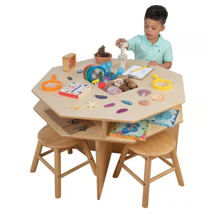 Child using the Constructive Playthings Discovery Table for hands-on STEM exploration, showing the birchwood construction and flat work surface of this classroom science centre table
