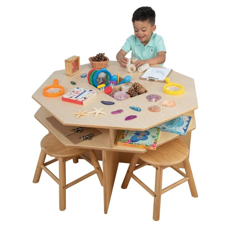 Children engaged in collaborative discovery at the Constructive Playthings Discovery Table, demonstrating the 4-seat science exploration table for preschool and daycare classrooms