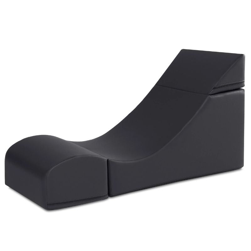 Jaxx Flexx convertible foam chair in black vinyl shown in its expanded lounge configuration, flexible seating for classrooms and calm corners