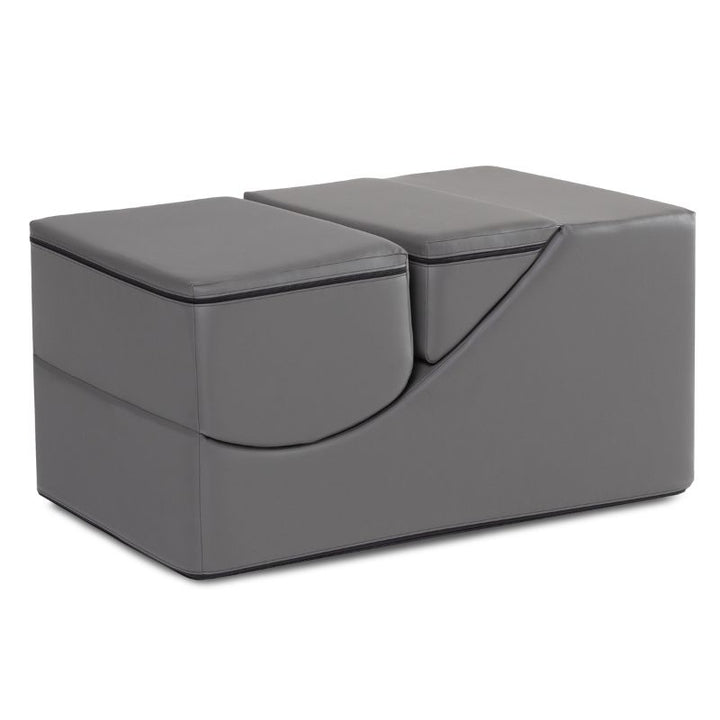 Jaxx Flexx convertible foam chair in charcoal vinyl folded into a bench, flexible seating for classrooms