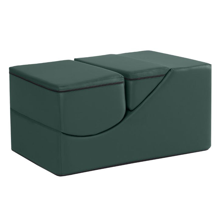 Jaxx Flexx convertible foam chair in deep sequoia green vinyl folded into a bench for calm corners and classrooms