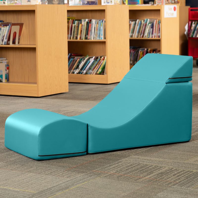 Jaxx Flexx convertible foam chair in teal vinyl staged in a classroom reading corner