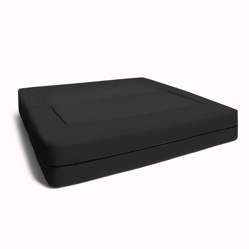 Jaxx Zipline convertible kids sofa in black, shown in its flat bed configuration with visible zip seam
