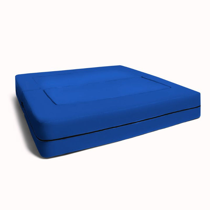 Jaxx Zipline flip sofa unfolded into a flat kids lounging bed in blue microsuede