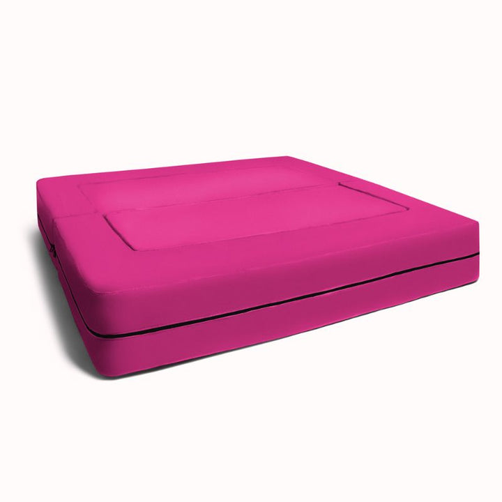 Jaxx Zipline convertible kids sofa folded flat into its lounging bed configuration in pink
