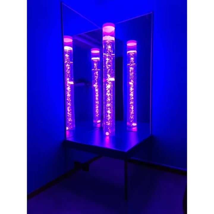 TFH Corner Bubble Tube Podium reflecting an illuminated bubble tube in blue light through its mirrored sides