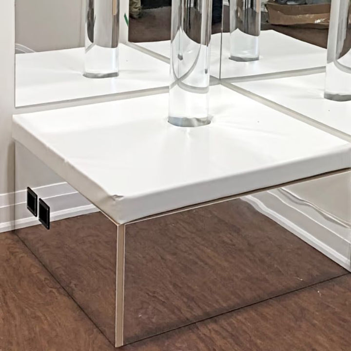 Close-up of the TFH Corner Bubble Tube Podium's padded top and mirrored acrylic sides