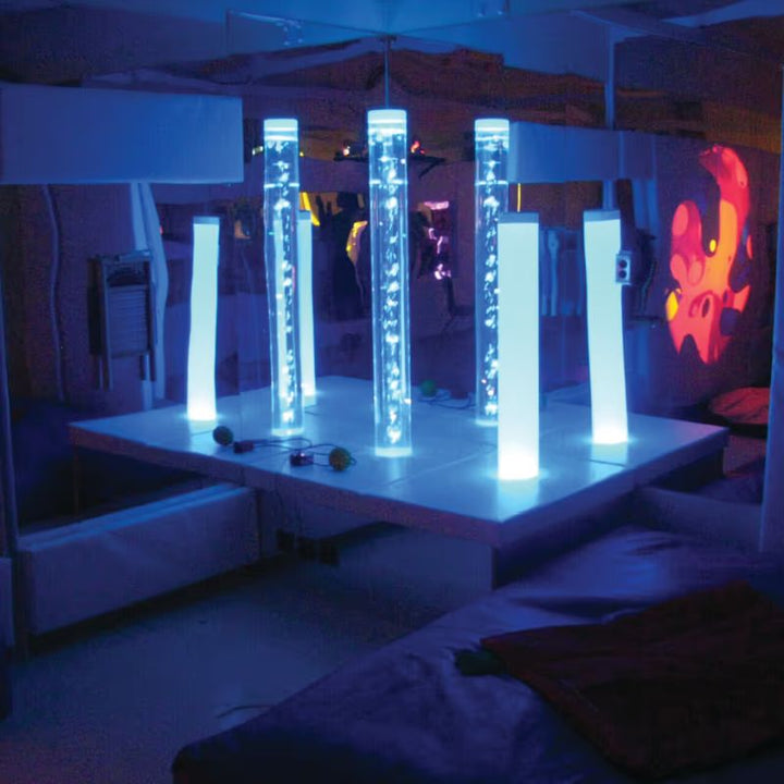 TFH sensory room set up with a mirrored corner podium reflecting illuminated bubble tubes