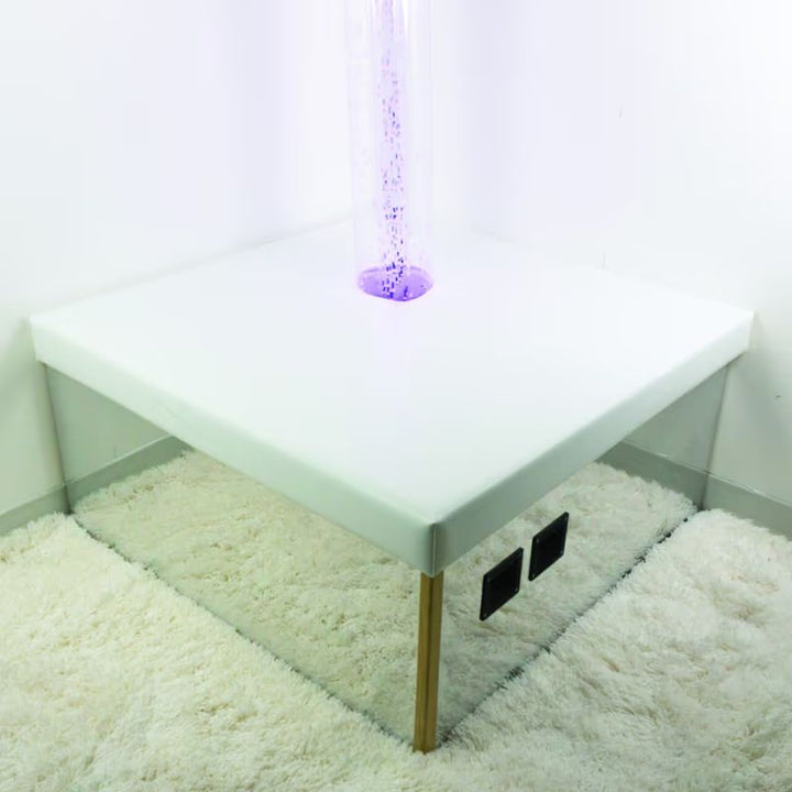 TFH Corner Bubble Tube Podium in a room corner with a purple bubble tube for sensory light play