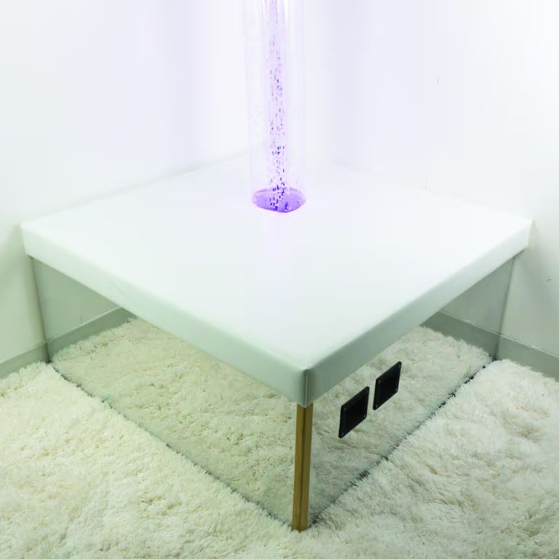 TFH Corner Bubble Tube Podium in a room corner with a purple bubble tube for sensory light play