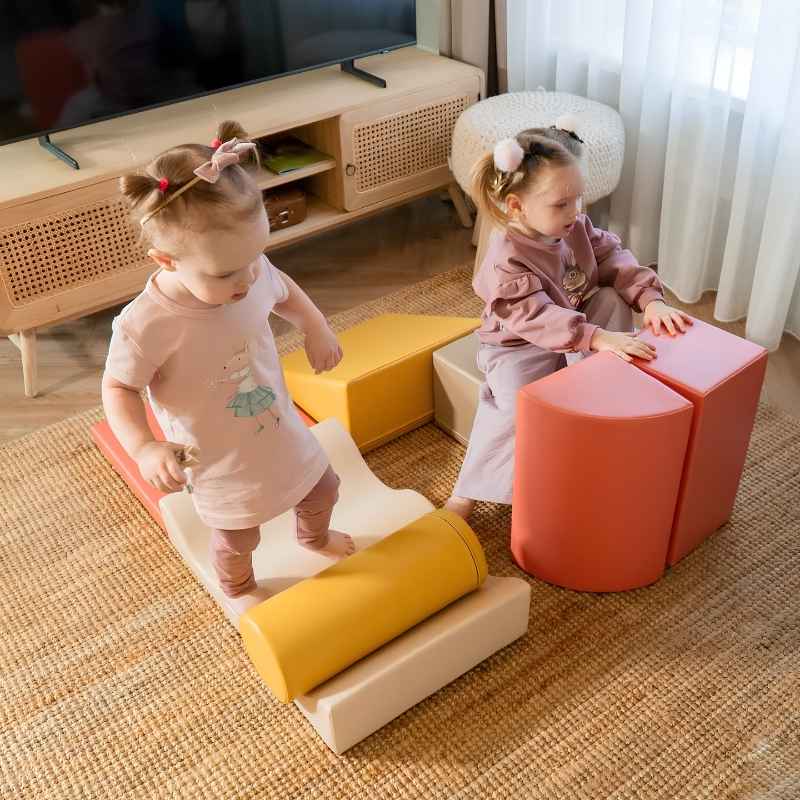 Two toddlers playing together on the IGLU Discoverer Soft Play Set in Pastel Fries, a foam set for shared active play