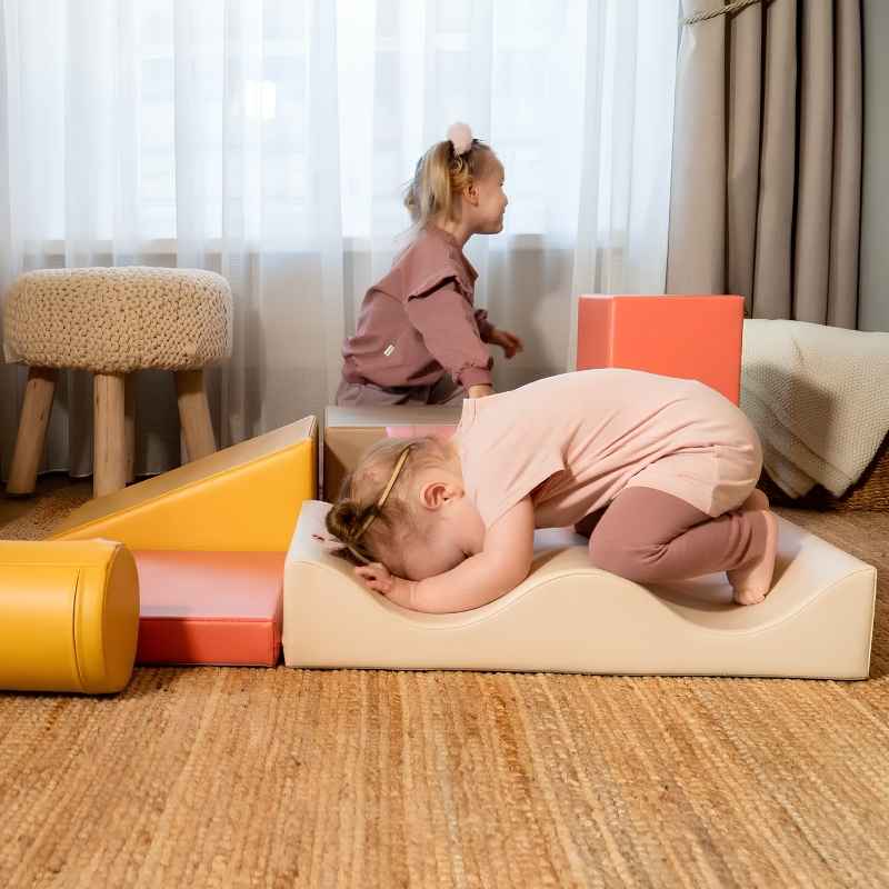 Toddler crouching on the IGLU Discoverer Soft Play Set in Pastel Fries during active indoor play