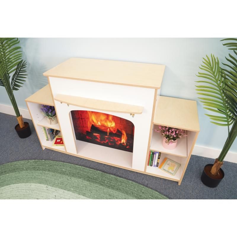 Overhead view of the Whitney Brothers Warm and Welcoming Fireplace showing its birch plywood top, mantel and side shelves, a classroom fireplace for home corners