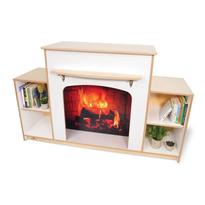 Whitney Brothers Warm and Welcoming Fireplace with books and plants on its adjustable shelves, a pretend fireplace with storage for dramatic play centers