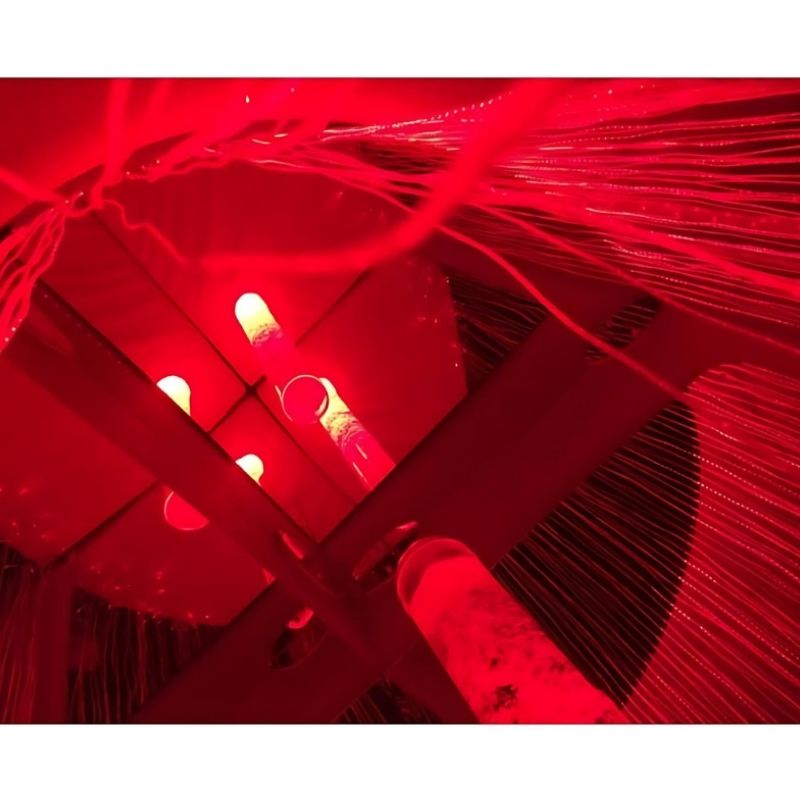 Close-up view from inside the Experia Calming Sensory Cocoon showing the fibre optic Corner Shower strands surrounding the user, demonstrating the enclosed immersive calming sensory experience
