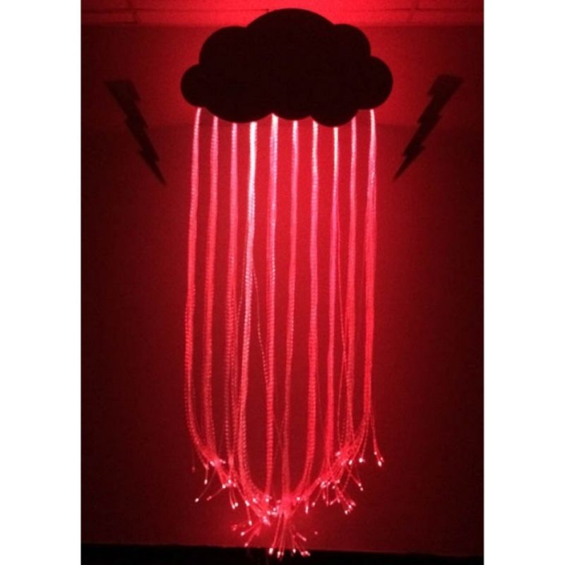 Experia Fibre Optic Raincloud front view in red light demonstrating the colour-changing Calming or Superactive fibre optic rainfall effect from the wall-mounted cloud installation
