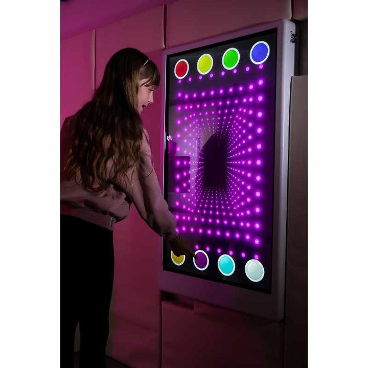 Teen engaging with the Experia Intelli Panel Infinity touchscreen sensory panel displaying purple infinity effects