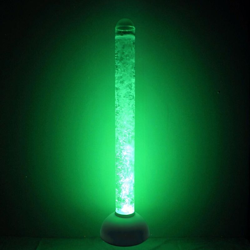 Experia IRiS LED Bubble Tube landscape view in green light, showing the IRiS-compatible wireless bubble tube for sensory rooms in a dark room environment