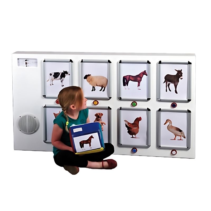 Child actively engaging with the Experia IRiS Soundboard and Qube Bundle, demonstrating the roll-to-match mechanic that triggers matching image lighting and recorded sound on the communication panel