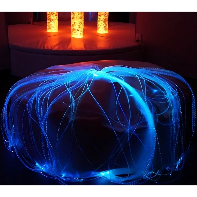 Experia LED Fibre Optic Softie landscape view in blue light showing the integrated beanbag seat with 150 colour-changing fibre optic strands cascading from the light source