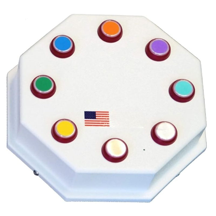 Close-up of the Experia Superactive 9-button wireless controller showing the colour-coded buttons and Qi charging interface included in the LED bubble tube bundle