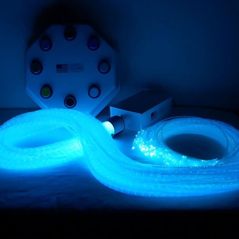 Close-up of Experia Superactive LED Fibre Optic strands glowing in blue, showing the colour-changing tactile sensory lighting in the interactive multi-sensory room package