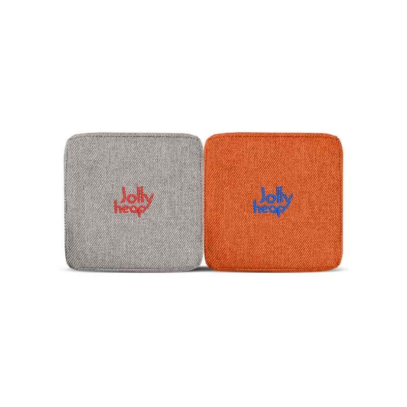 Woven fabric swatch for the JollyHeap Extra 16 magnetic block expansion set in grey and orange, showing the embroidered logo detail and textured cover