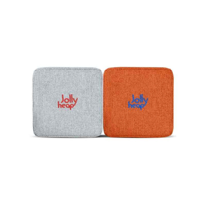 Woven fabric swatch for the JollyHeap Extra 16 magnetic block expansion set in light grey and orange, showing the embroidered logo detail and textured cover 
