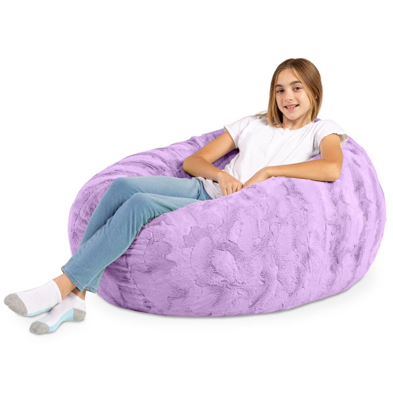 A child reclining into the Jaxx Cocoon Fur faux fur bean bag chair in Purple, showing its supportive lounging shape