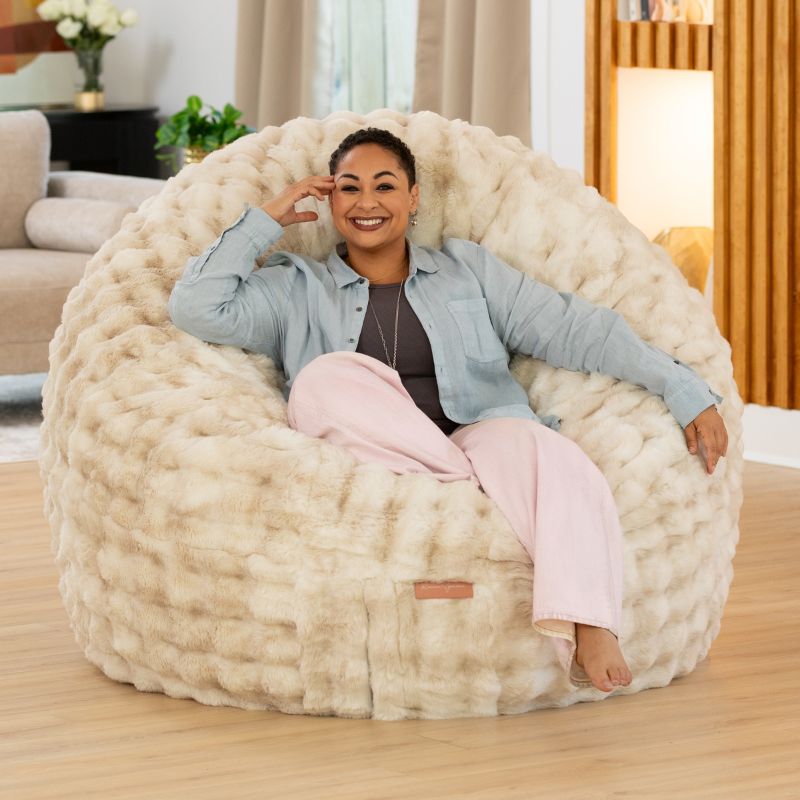Big Snuggler by Raven-Symone faux fur bean bag lounger in Phantom Cream, an oversized chair for relaxing at home
