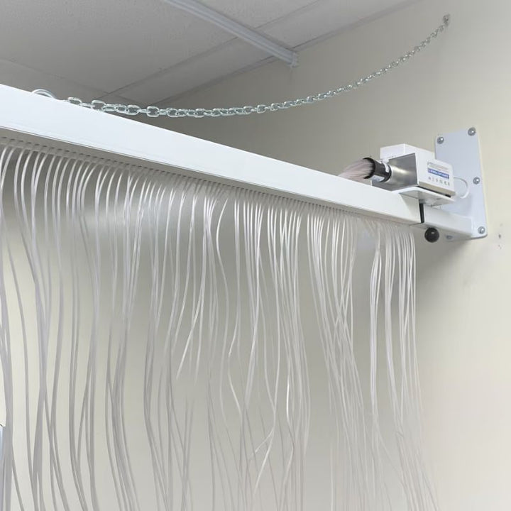 Close-up of the adjustable wall bracket and light source on the TFH Fiber Optic Curtain, showing the 100 cascading tails