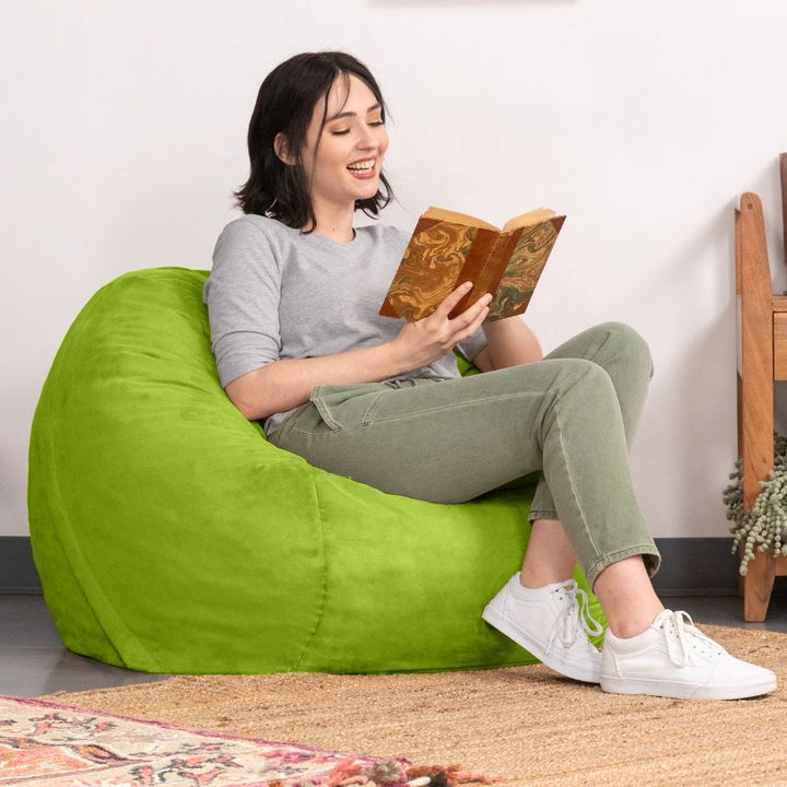 Woman reading in a Lime microsuede Jaxx Saxx 3ft foam bean bag chair, cheerful calm corner seating for home or classroom