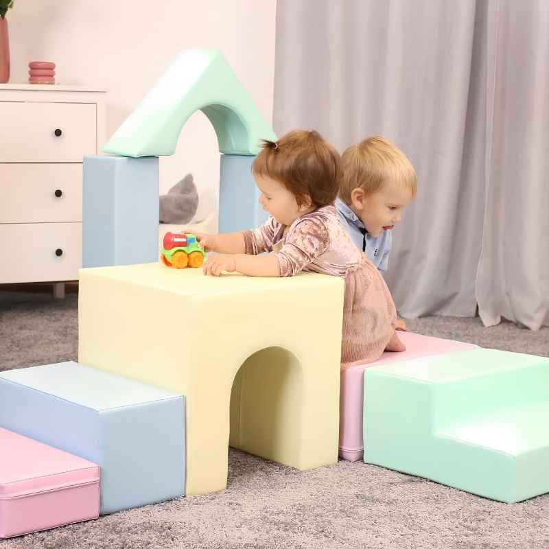 Two children playing together on the IGLU Foam Play Set Creativity in Light Pastel, supporting social and independent play