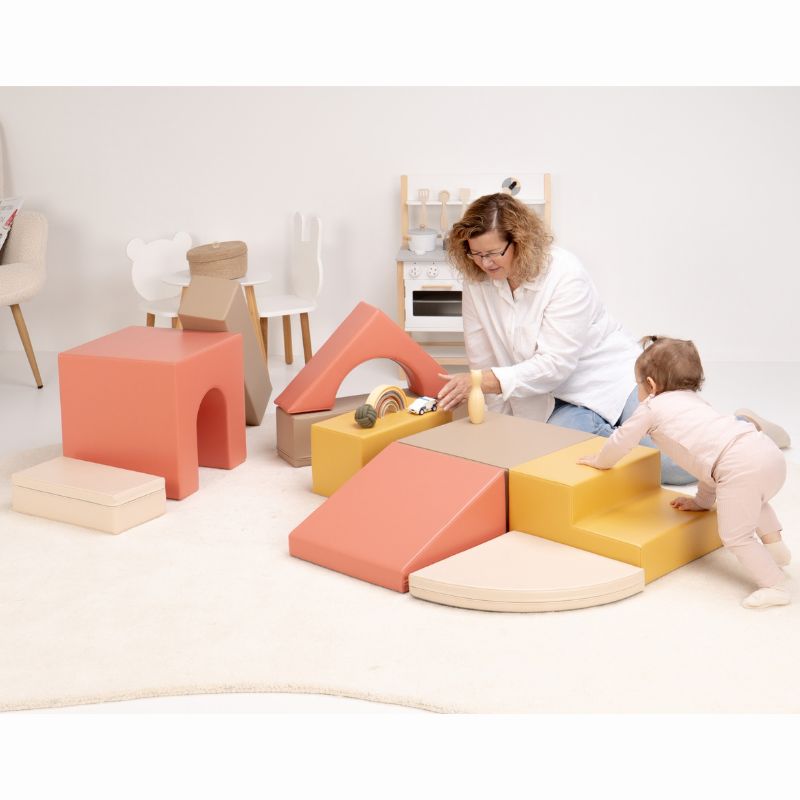 Baby pulling up at the two-step block of the IGLU Foam Play Set - Creativity, rearranged into a new soft play set layout