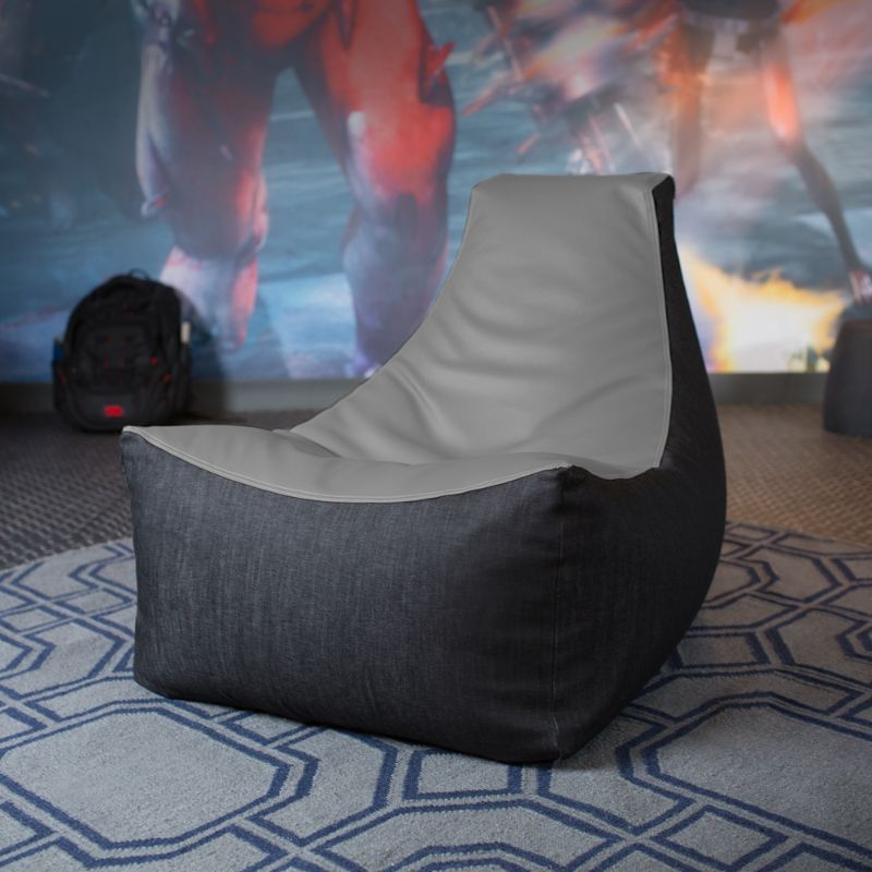 The Jaxx Pixel gaming bean bag chair in charcoal sits in a game room, a durable seat for kids