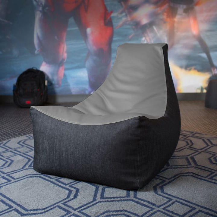 The Jaxx Pixel gaming bean bag chair in charcoal sits in a game room, a durable seat for kids