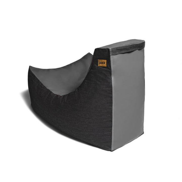 Side view of the Jaxx Pixel gaming bean bag chair in charcoal grey vinyl and denim, a durable sensory seating option