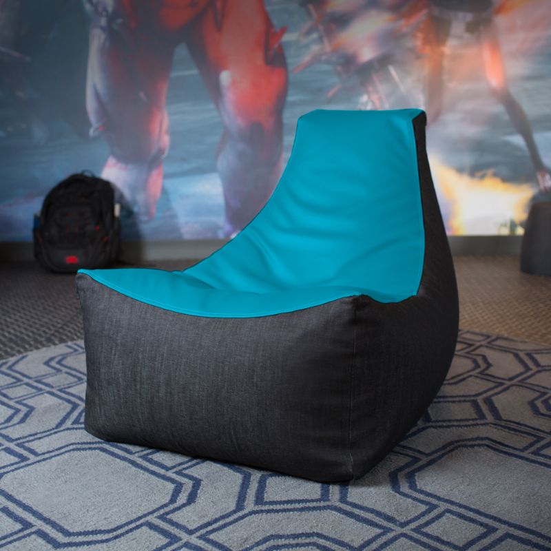 The Jaxx Pixel gaming bean bag chair in teal sits in a game room, a wipes-clean seat for classrooms